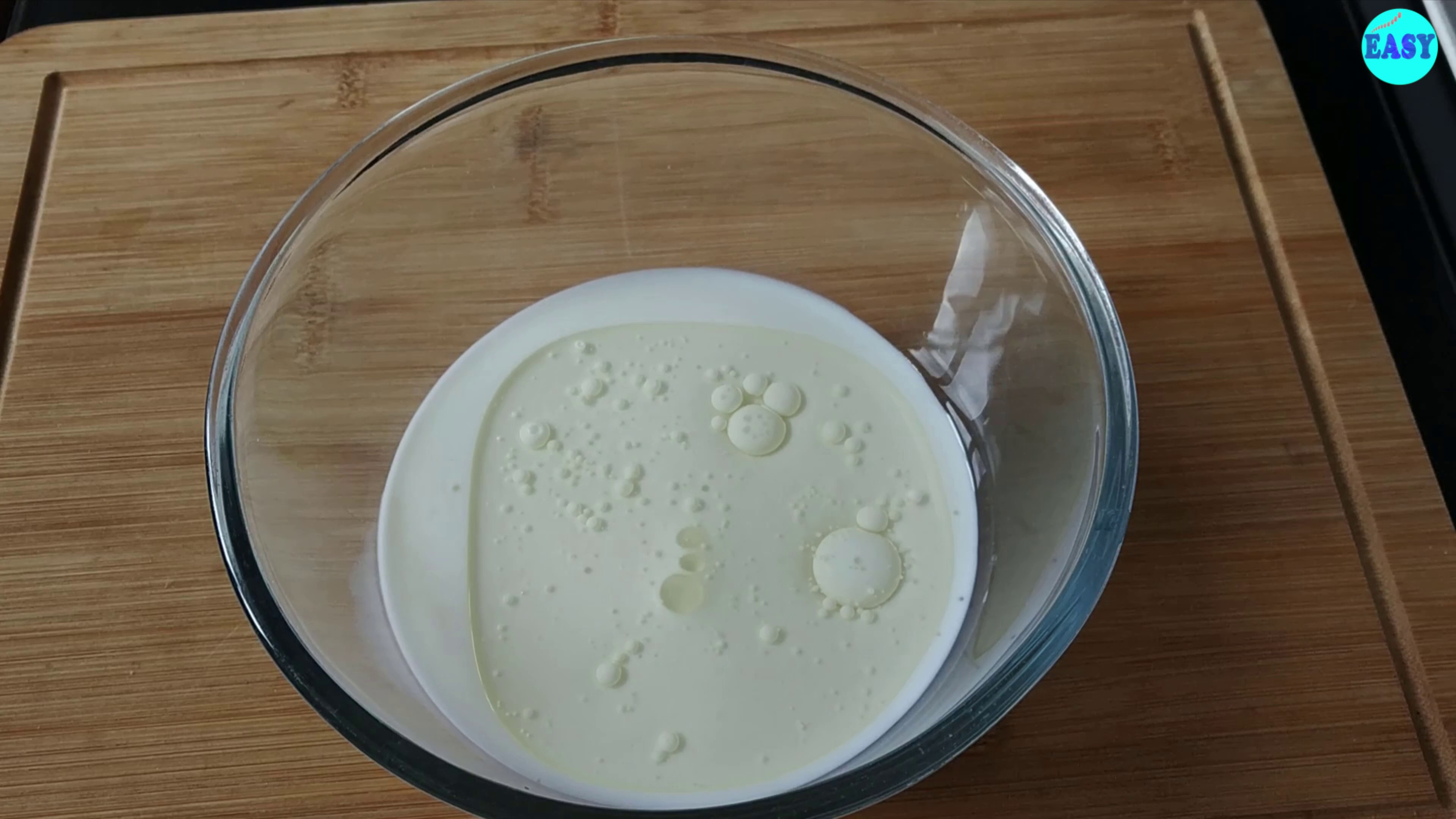 Step 1 - In a mixing bowl take milk, sugar oil and vanilla extract. Whisk it well to combine or until sugar is dissolved.