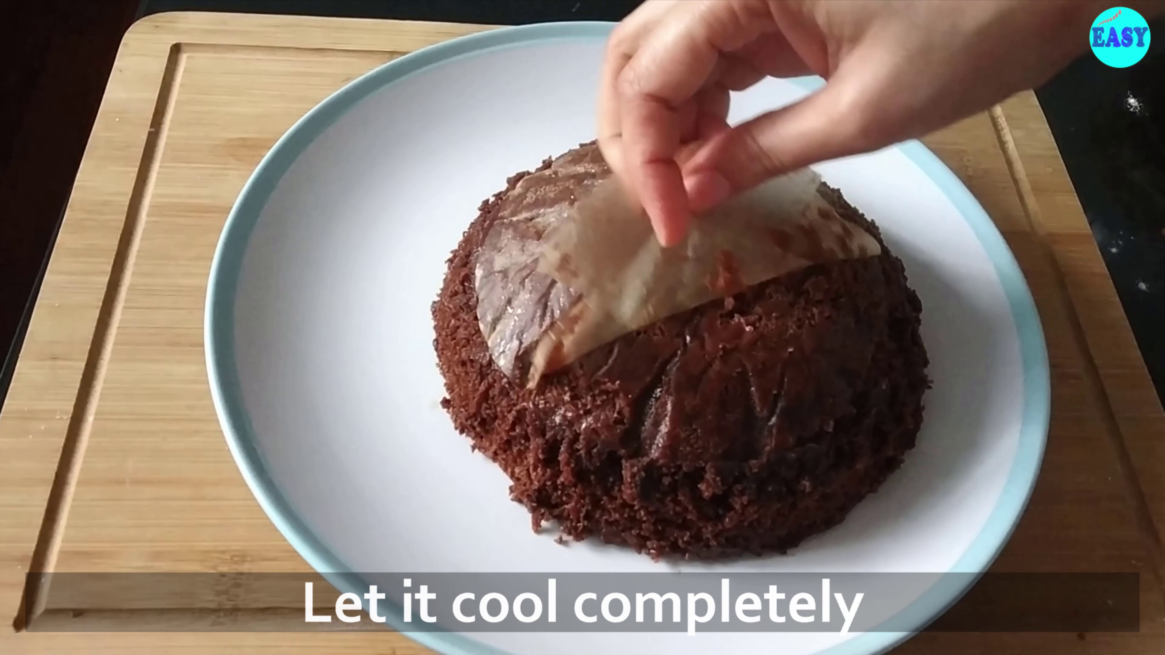 Step 10 - Then unmould it, remove the butter paper and let it cool completely before icing.