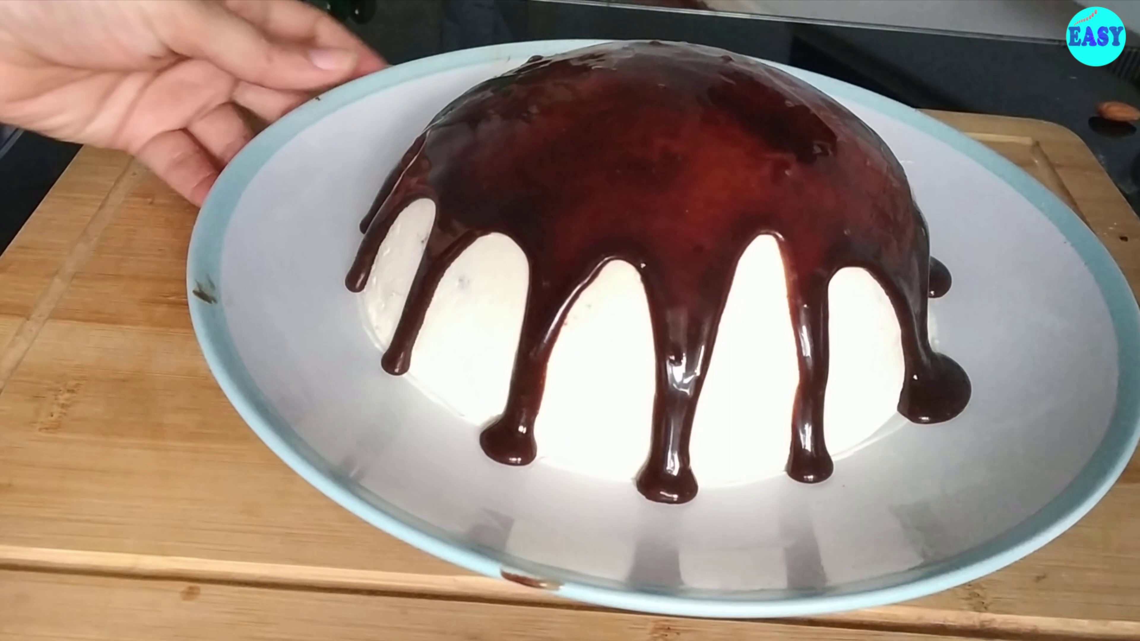 Step 18 - Take out the chilled cake and pour the ganache over it, making the lovely drips on sides.