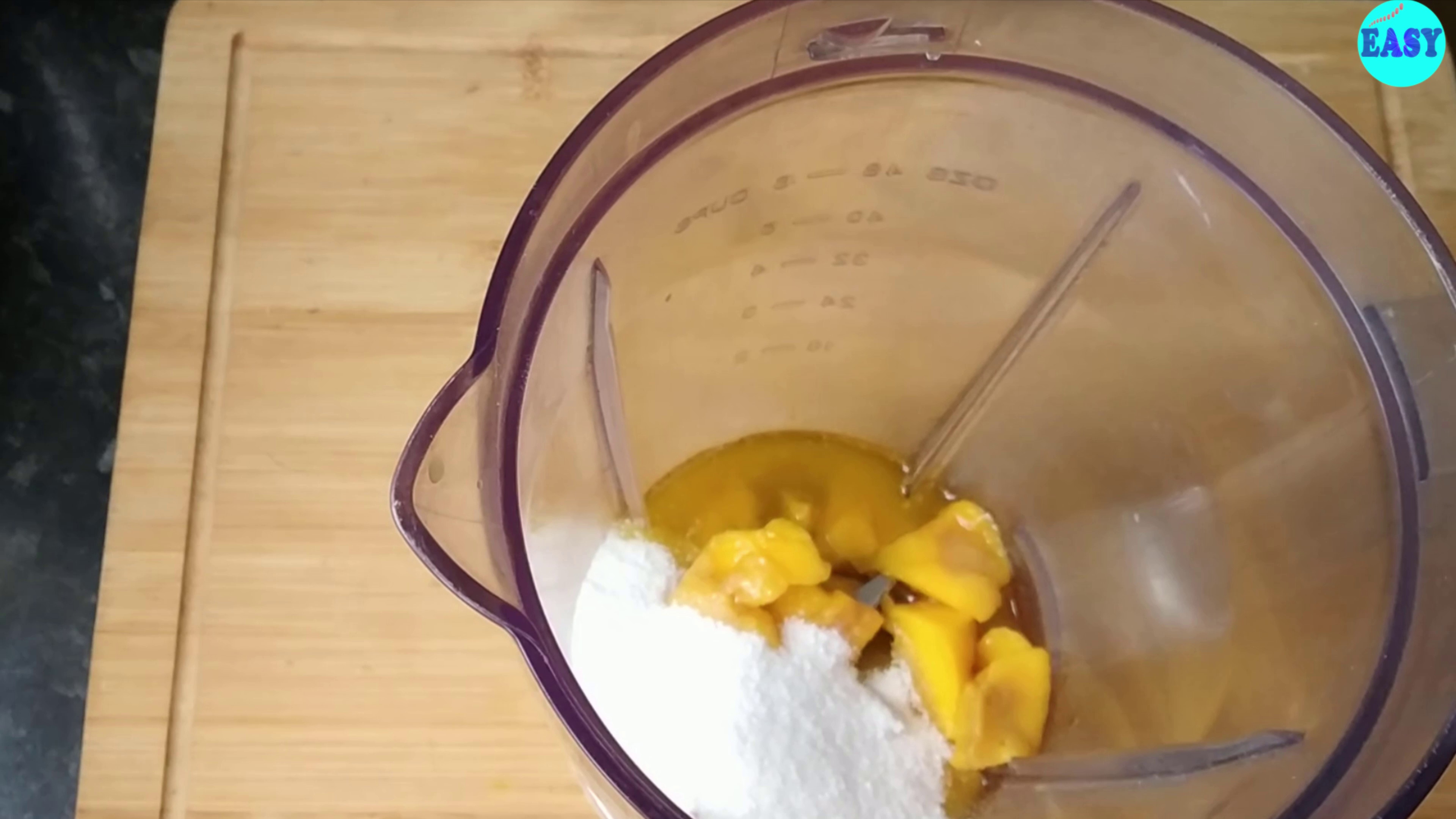 Step 1 - Take mango pulp, sugar, butter and milk in a blender and make a smooth paste out of it.