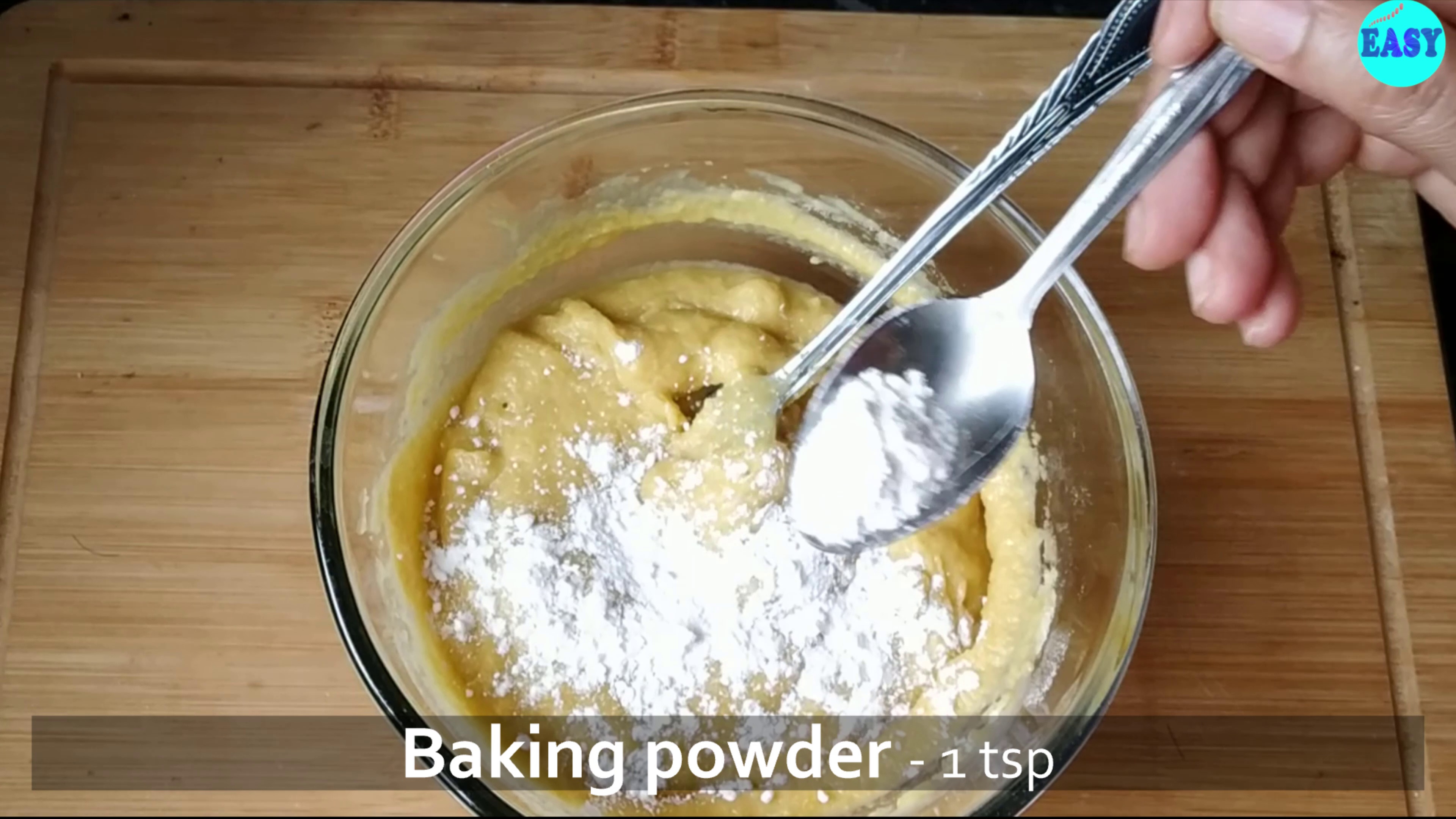 Step 5 - Now add baking powder, baking soda and curd to the mixtures and mix everything well. Add more milk if needed to adjust the consistency.