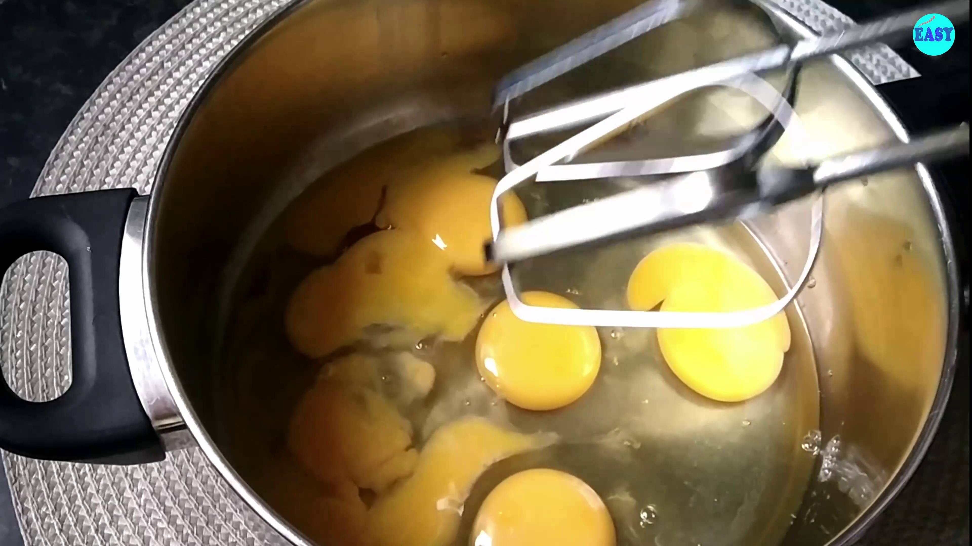 Step 5 - In a large mixing bowl take eggs and beat them with the help of an electric whisk.