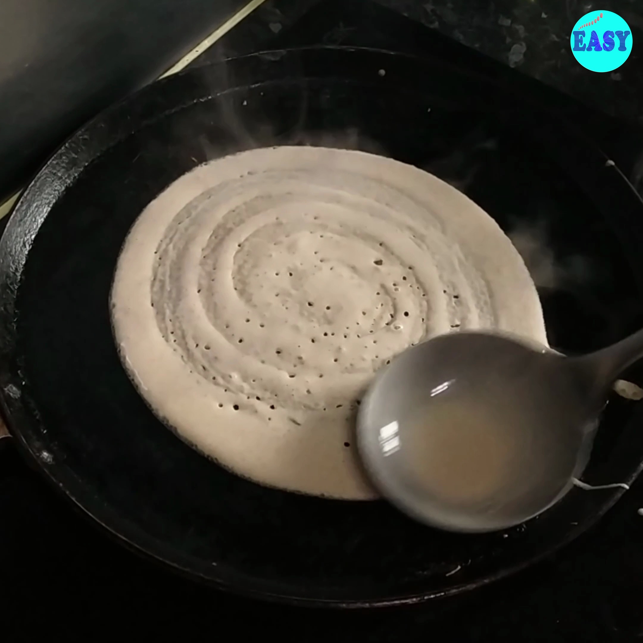 Step 7 - 7. After adding the batter onto the hot pan, spread it into a thin circle.