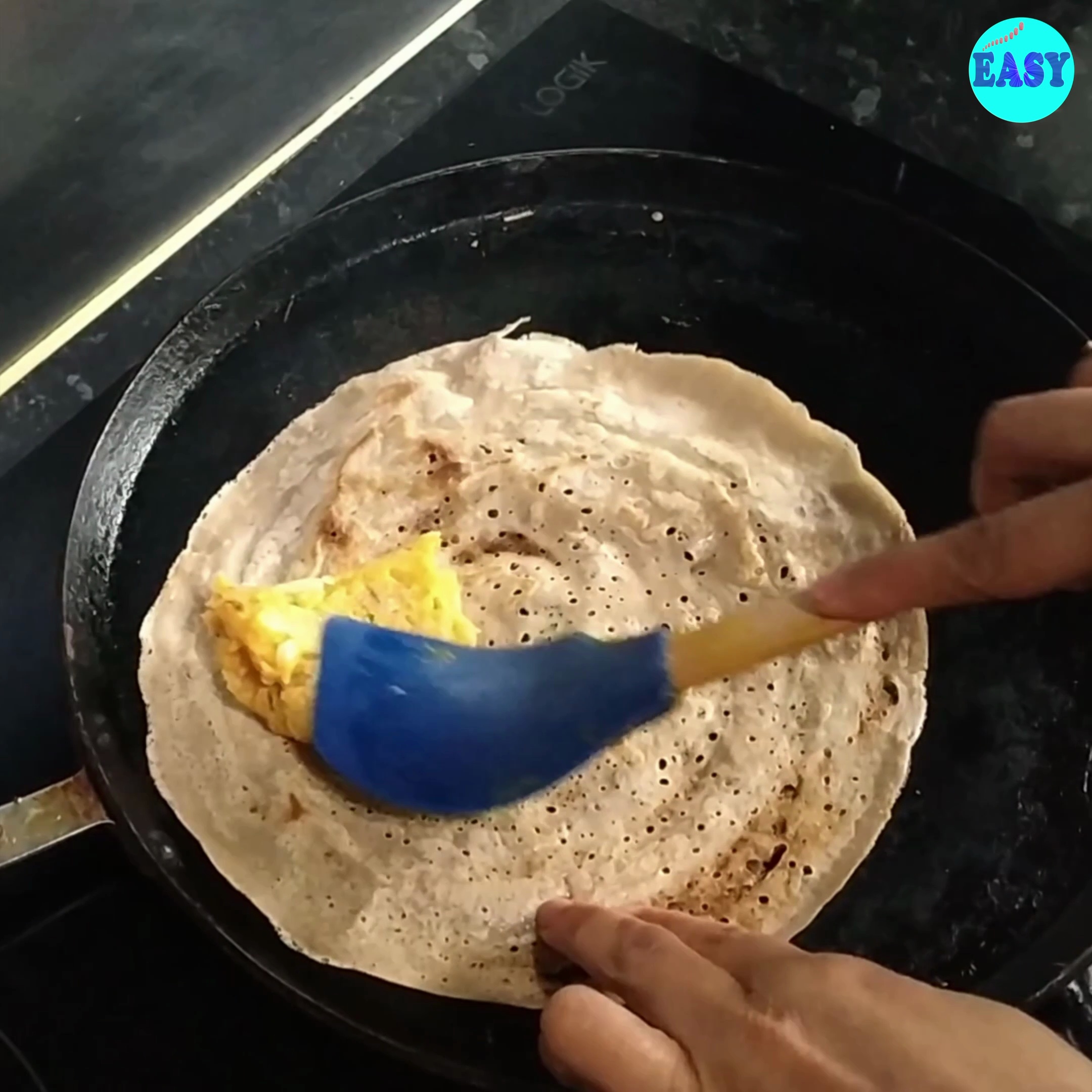 Step 9 - 9. Carefully flip the dosa and cook for another 1-2 minutes until the other side is crisp. Add the masala on top and remove from the pan.