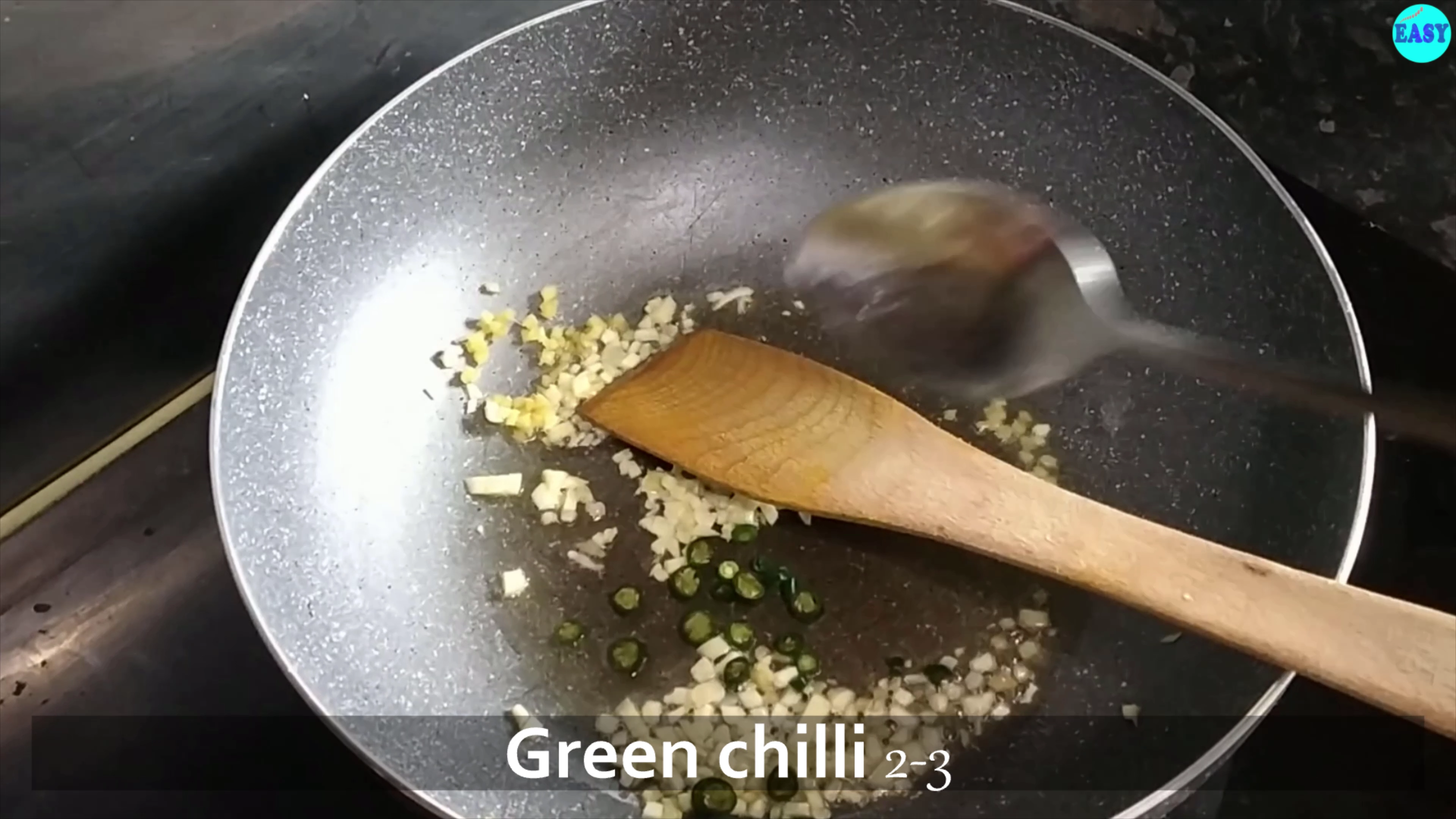 Step 3 - Heat a pan and add oil to it. Add chopped garlic and ginger, saute for a minute .