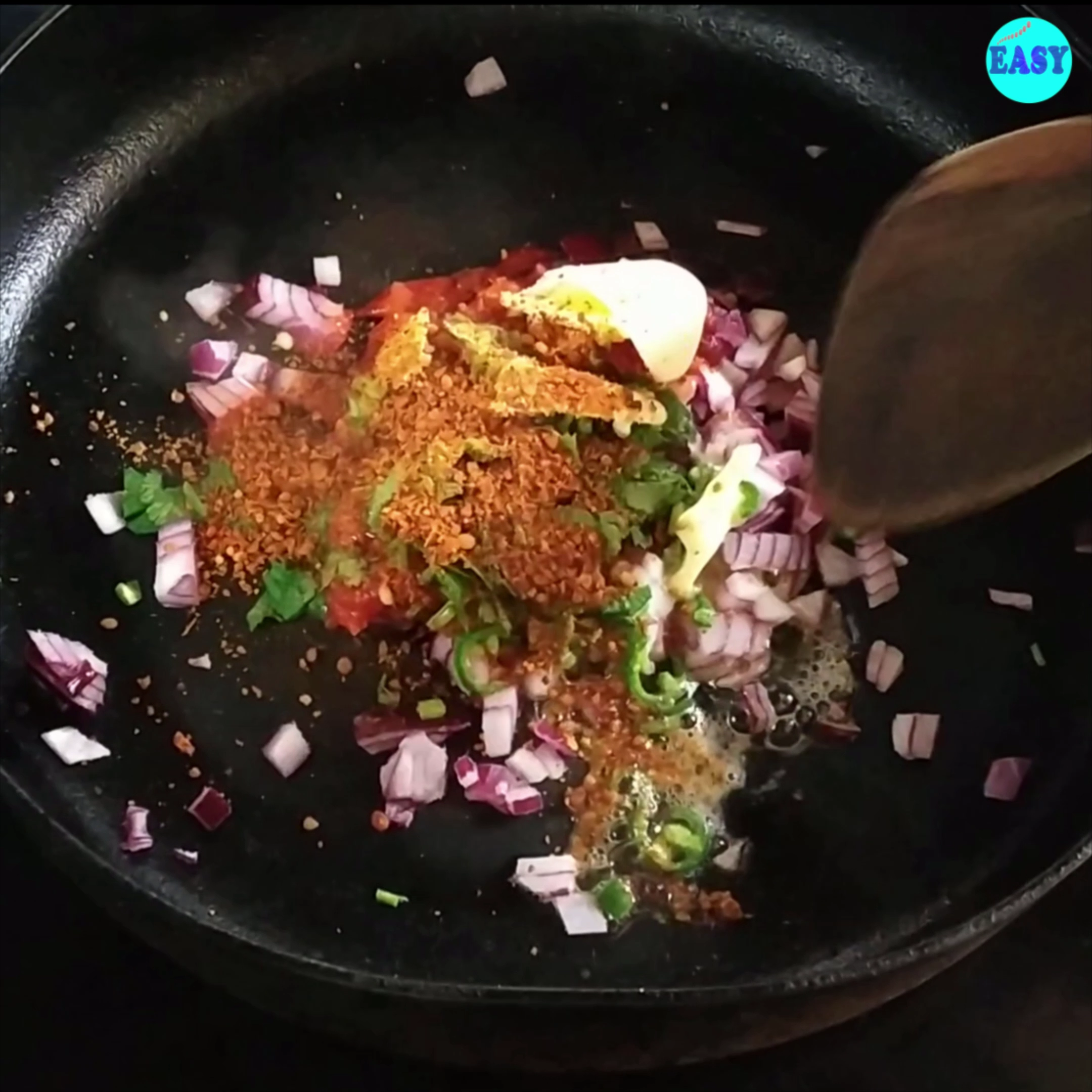Step 1 - Heat a pan and add onion, tomatoes,green chilli, coriander, butter and idli podi masala to it. If you don’t have idly masala add ½ tsp of sambar masala instead.