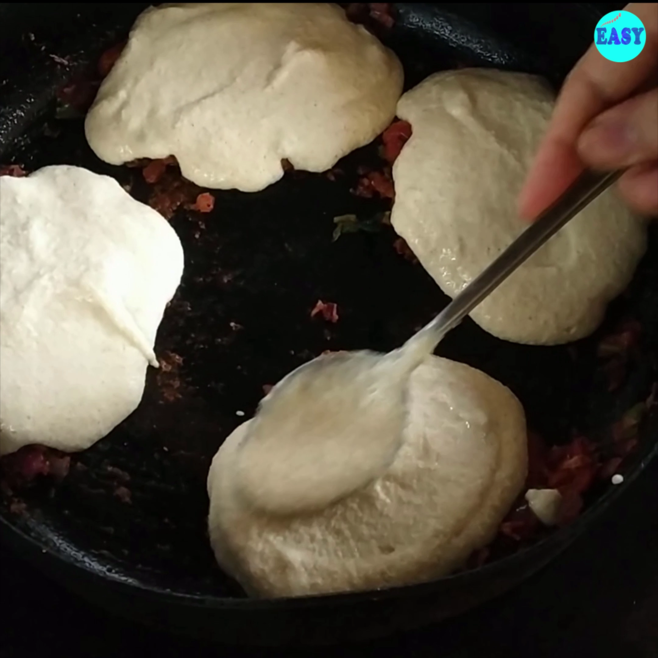 Step 3 - Pour over the idli batter on the masala and sprinkle some more podi masala on top.