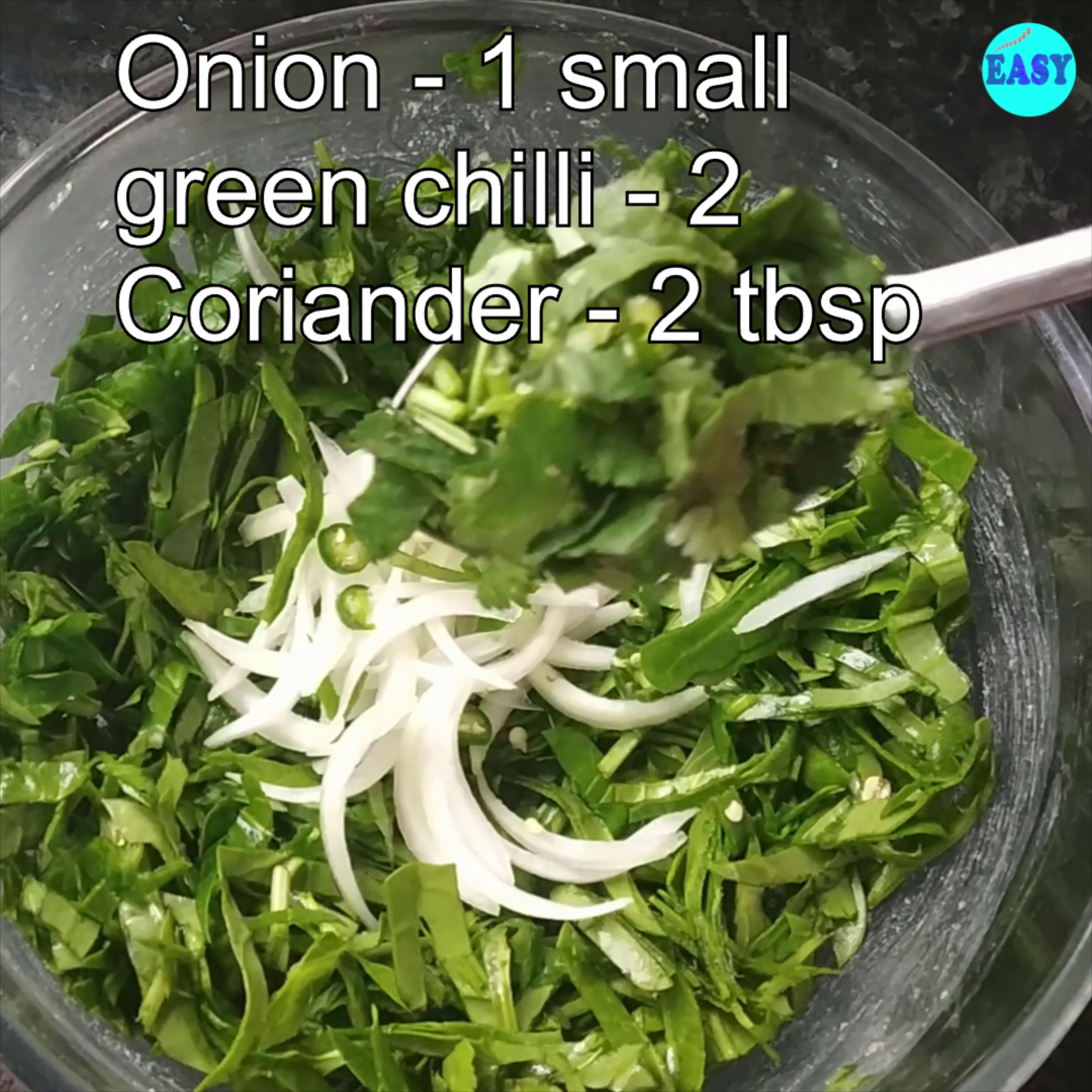 Step 1 - In a big mixing bowl take spinach, onion, green chilli and coriander leaves.