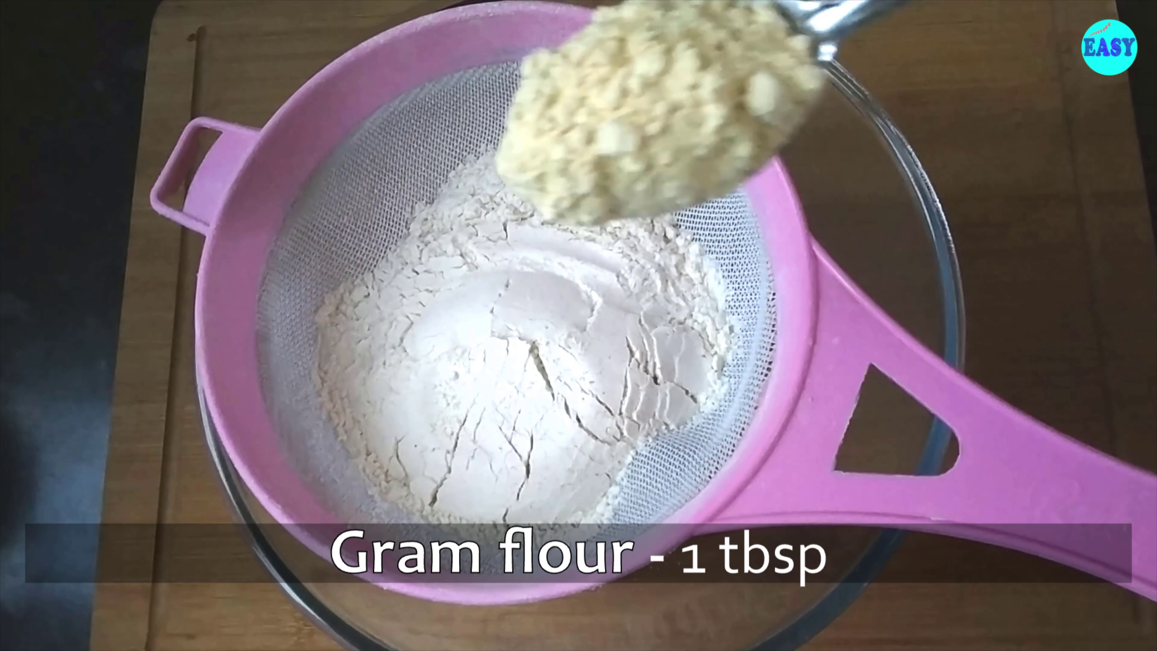 Step 1 - In a big mixing bowl take wheat flour and gram flour and sift it together.