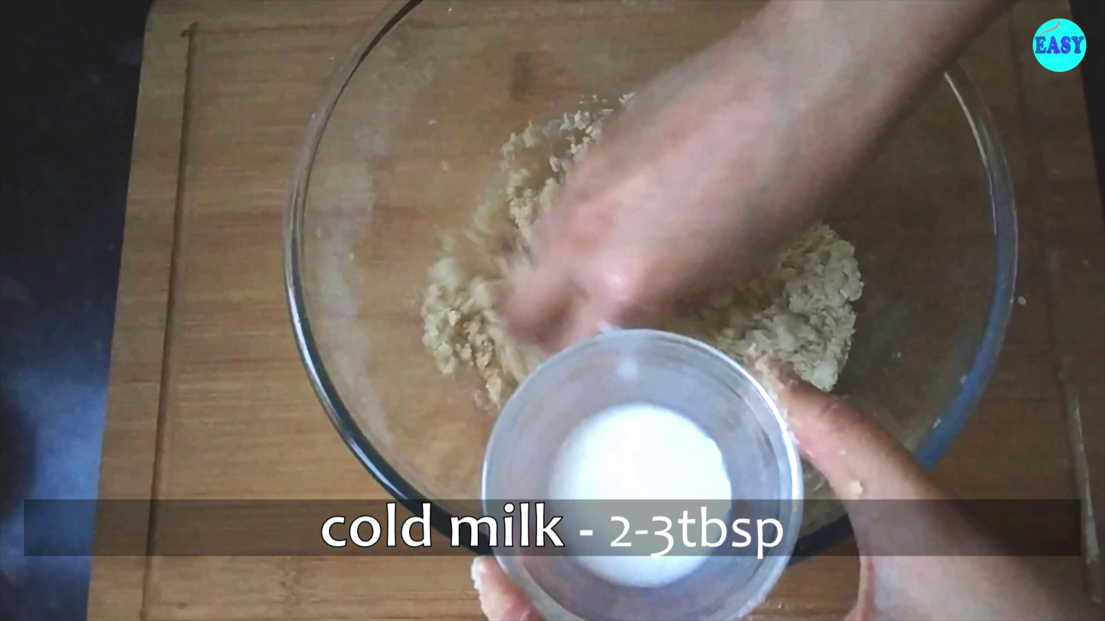 Step 5 - Now add cold water or milk and mix it roughly with your fingertips.