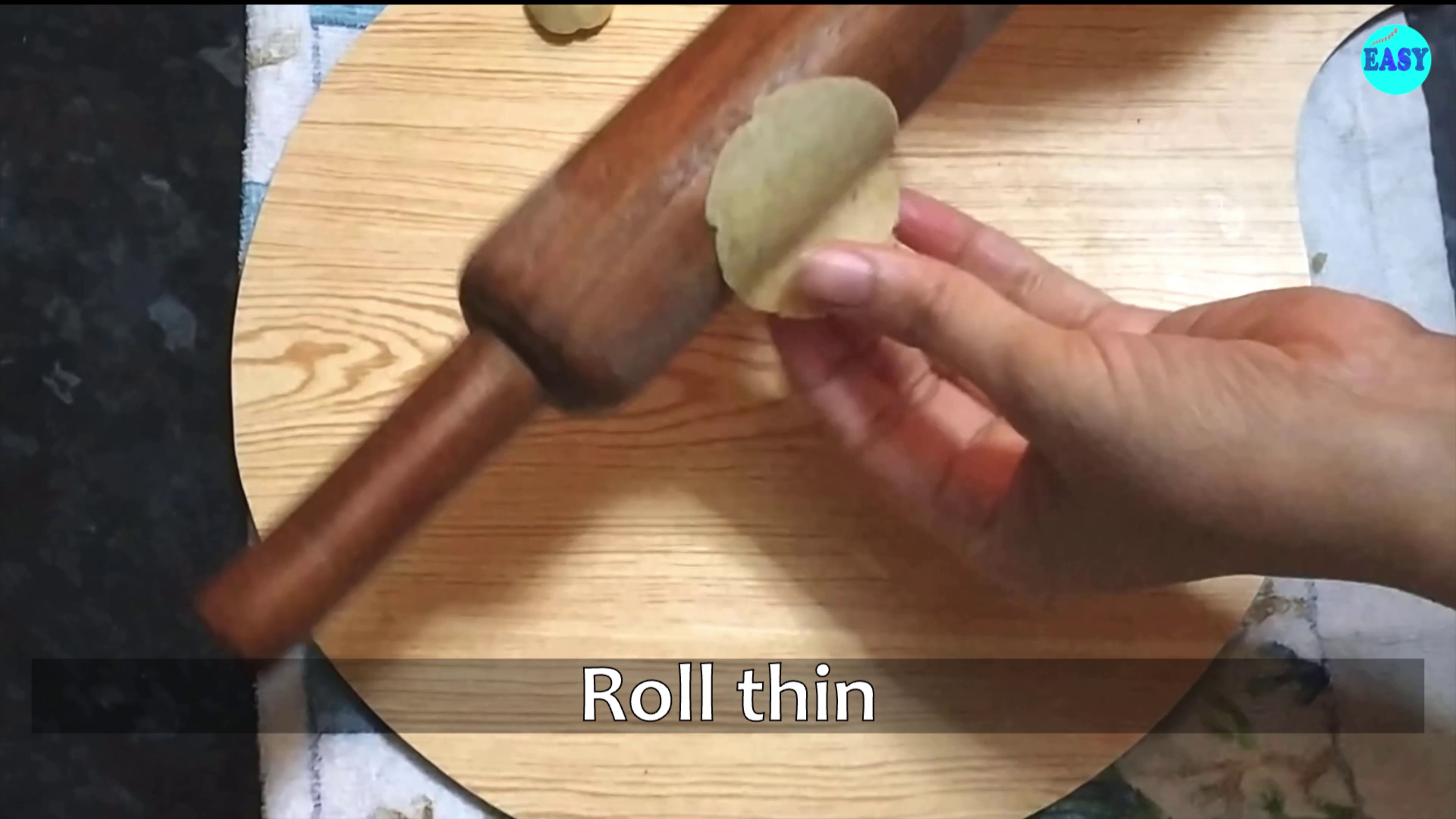 Step 8 - Now make the small balls out of the dough and roll it thin with the help of a rolling pin. Alternatively, you can roll a big sheet and cut it with the help of any cutter or glass.