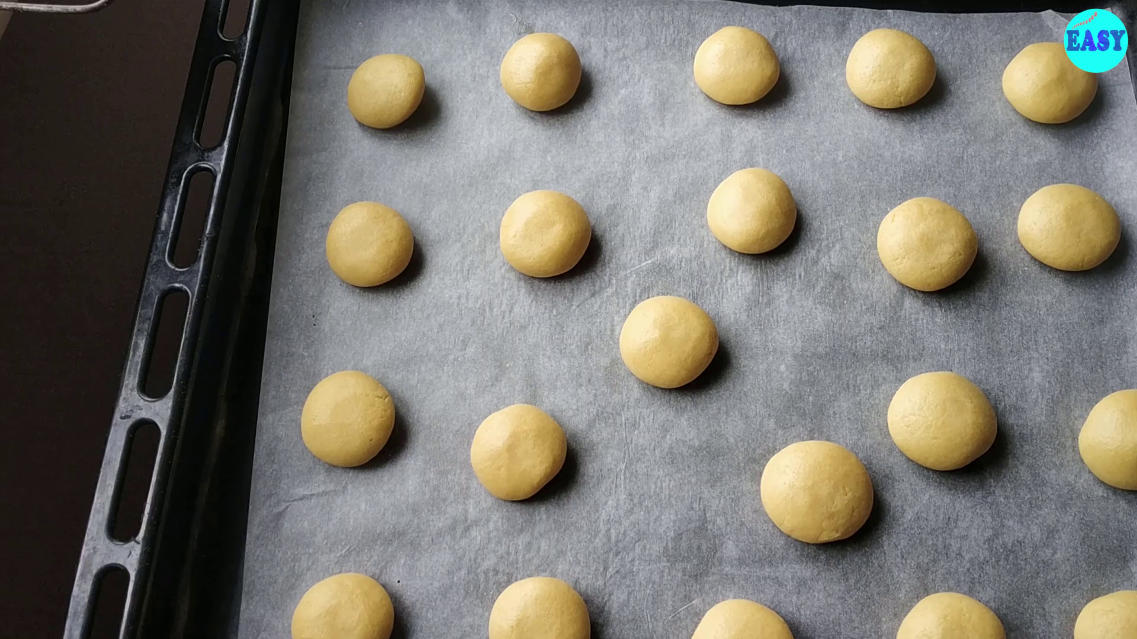 Step 6 - Place them in a baking tray lined with baking paper. Remember to keep some space between these as they expand while baking.