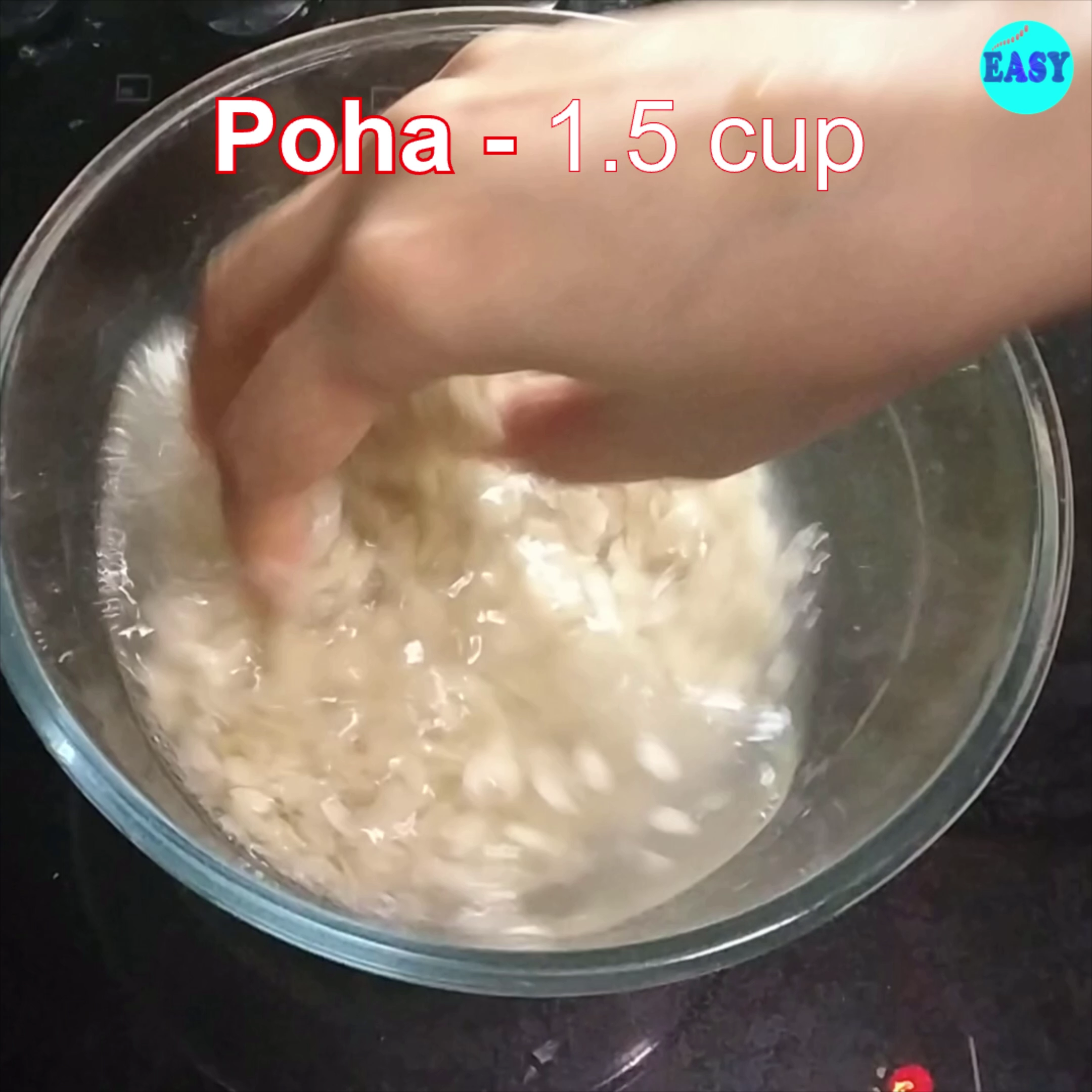 Step 1 - Take thick poha and wash it well with water one or two times. Drain the water and keep it aside. It should turn soft after this step. To check, press a flake between your thumb and index finger, it should break easily.