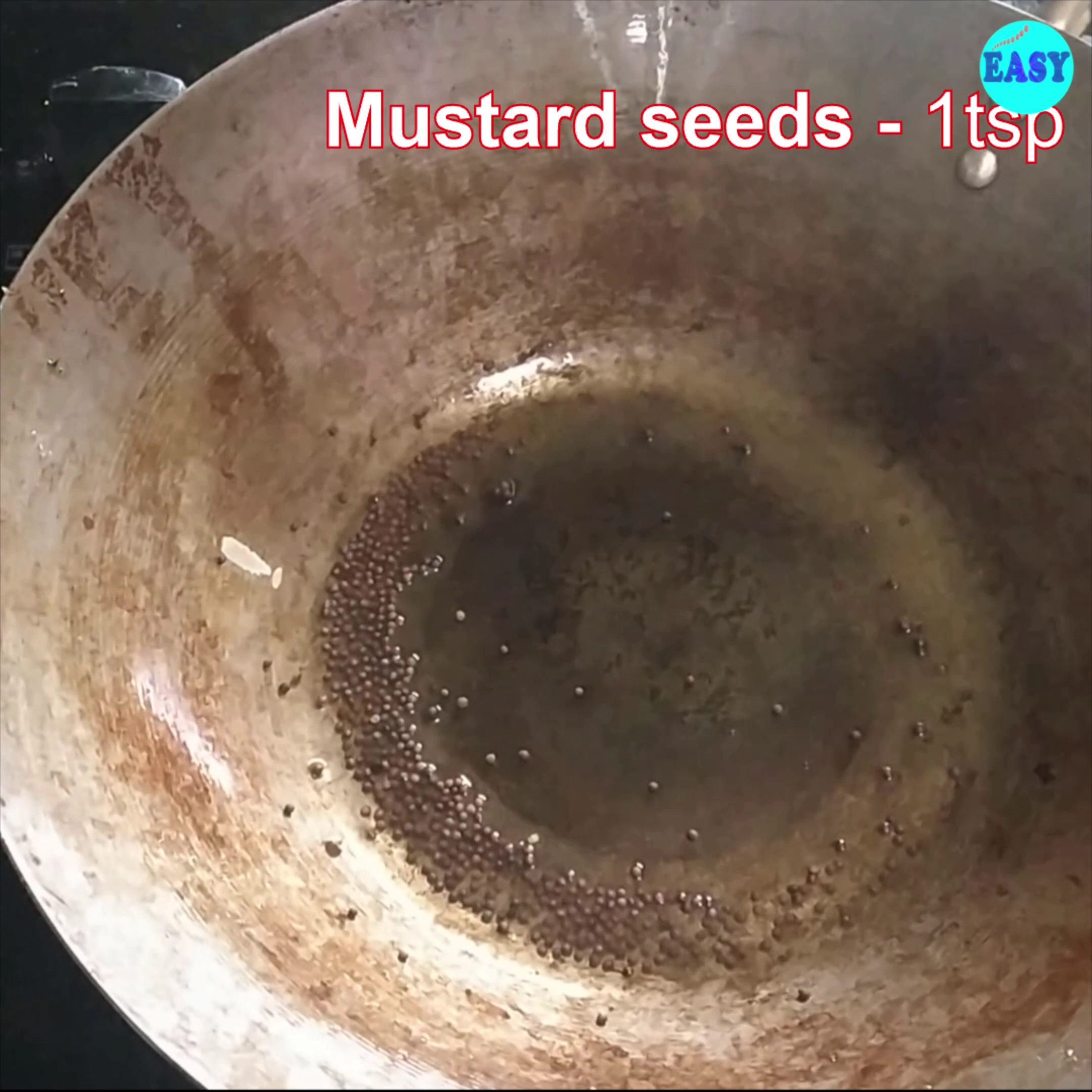 Step 6 - Now add remaining 1 tbsp of oil, add mustard seeds and allow them to splutter.