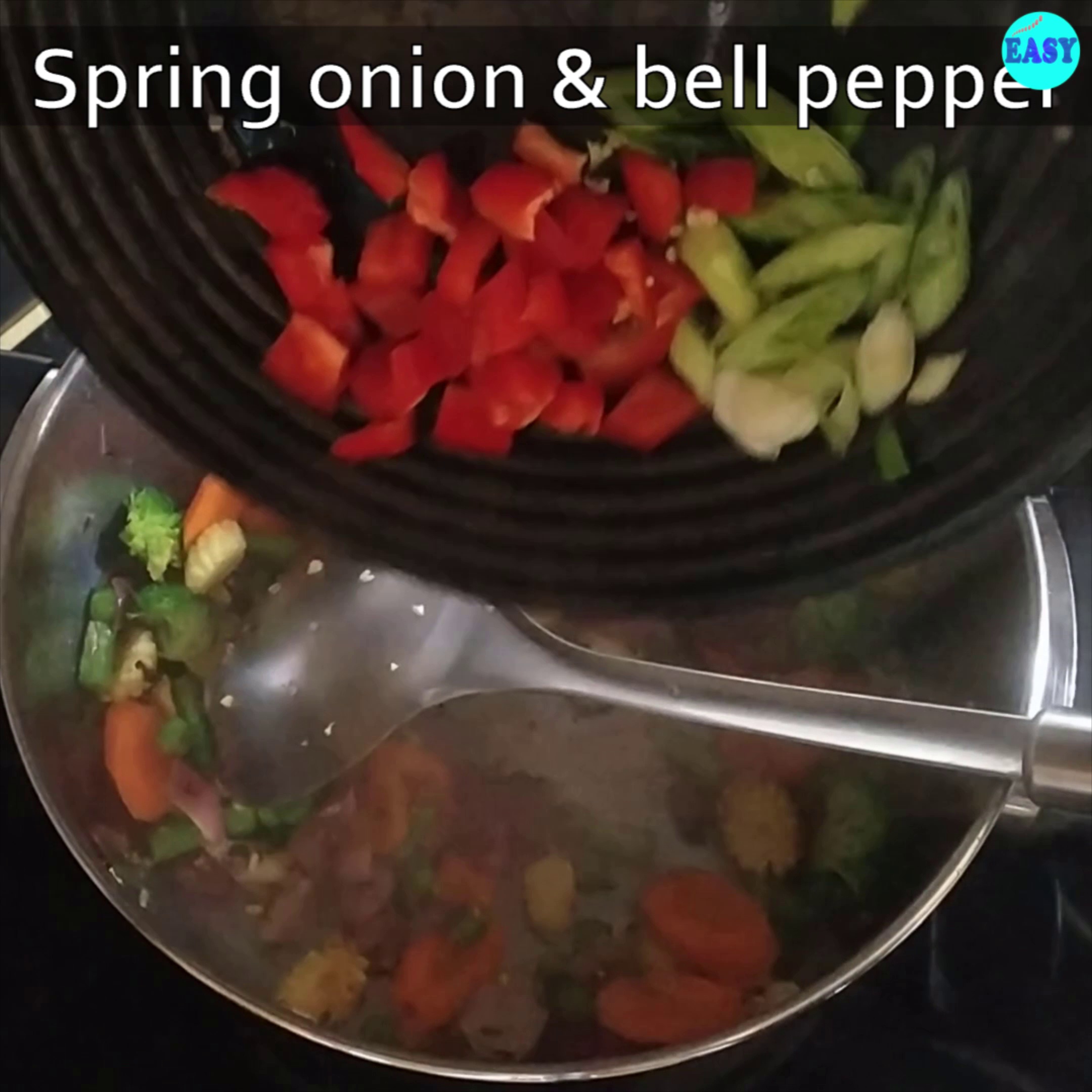 Step 6 - Add spring onions and bell pepper.