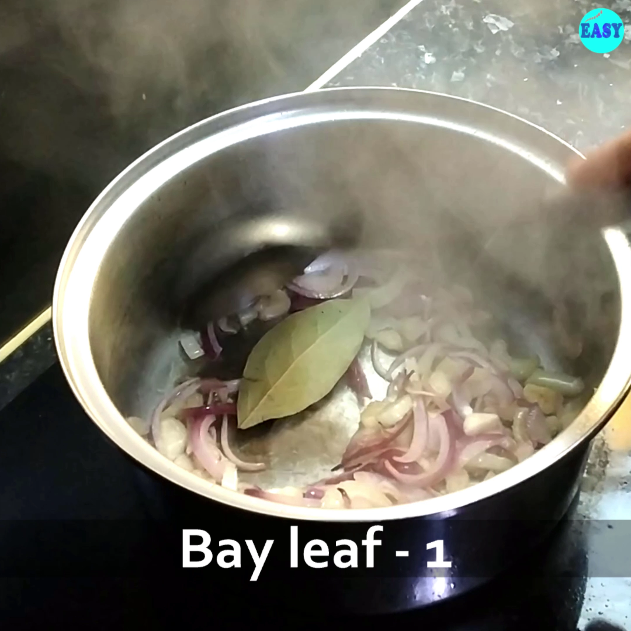 Step 2 - Add chopped onions, celery, garlic and bay leaf to it. Saute for few minutes until onion turns translucent.
