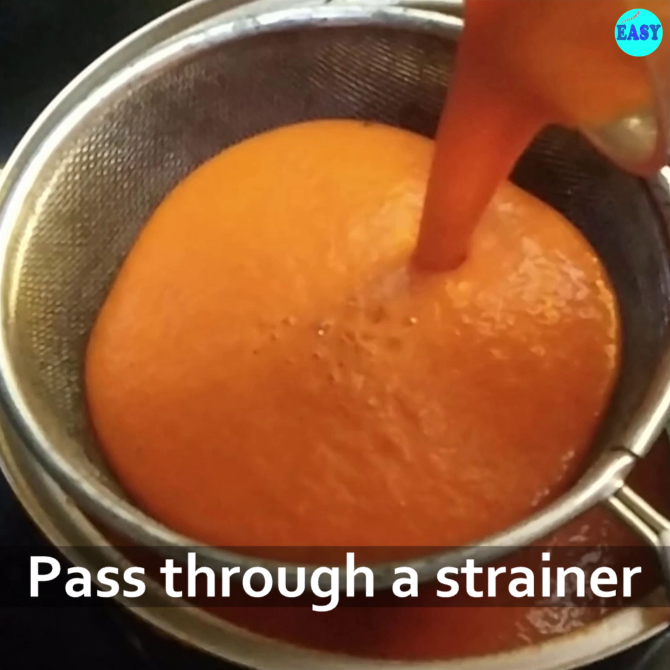 Step 6 - Pass the pureed tomato paste through a strainer. Though this step is optional but recommended to get a smooth texture of soup.