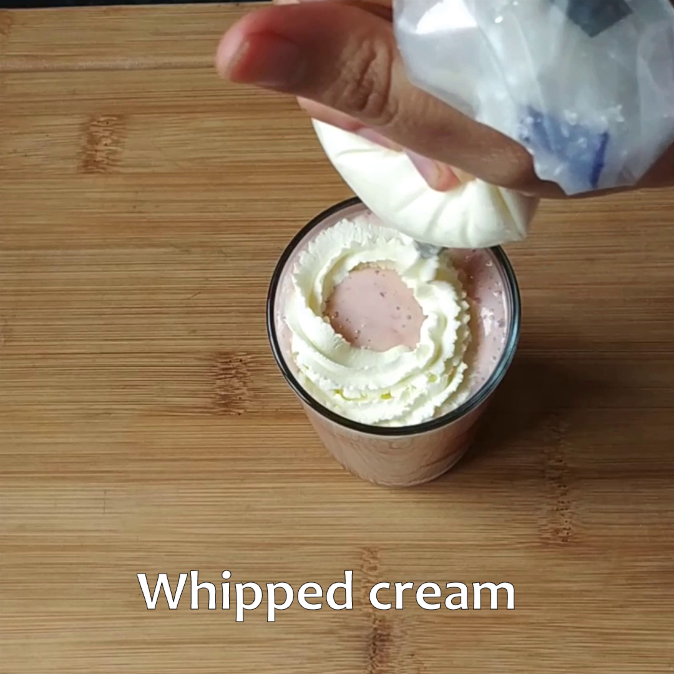 Step 6 - Top with a swirl of whipped cream and fresh strawberry.