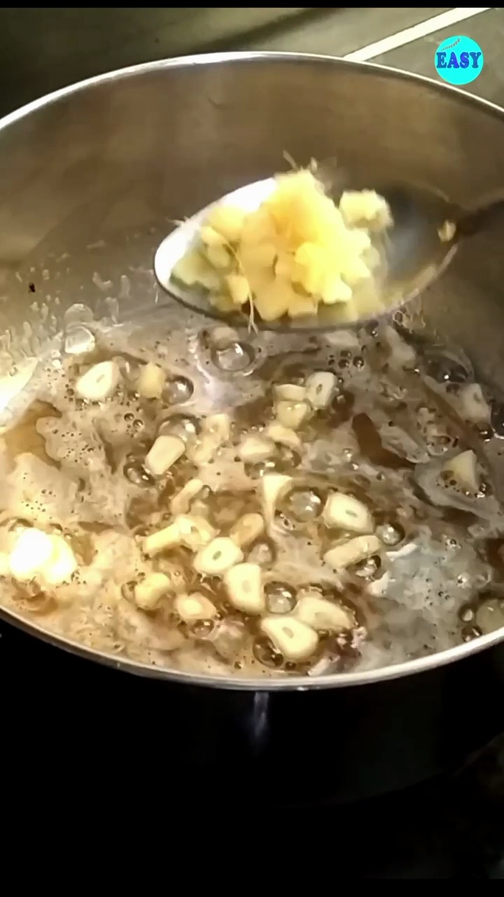 Step 3 - Now add chopped garlic and ginger, sauté for a minute.