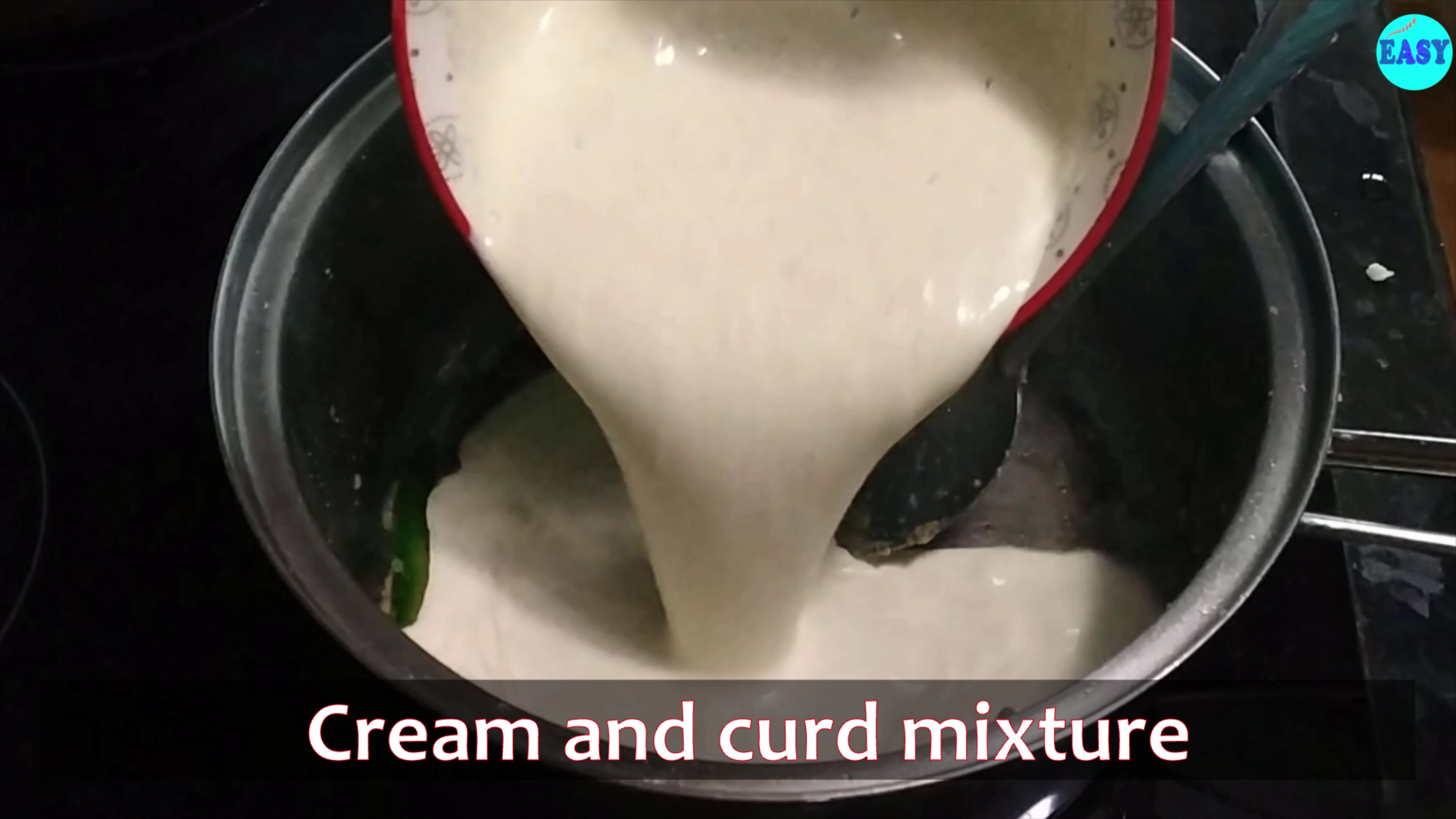 Step 3 - When ginger paste is cooked well add the cream and curd mixture.  