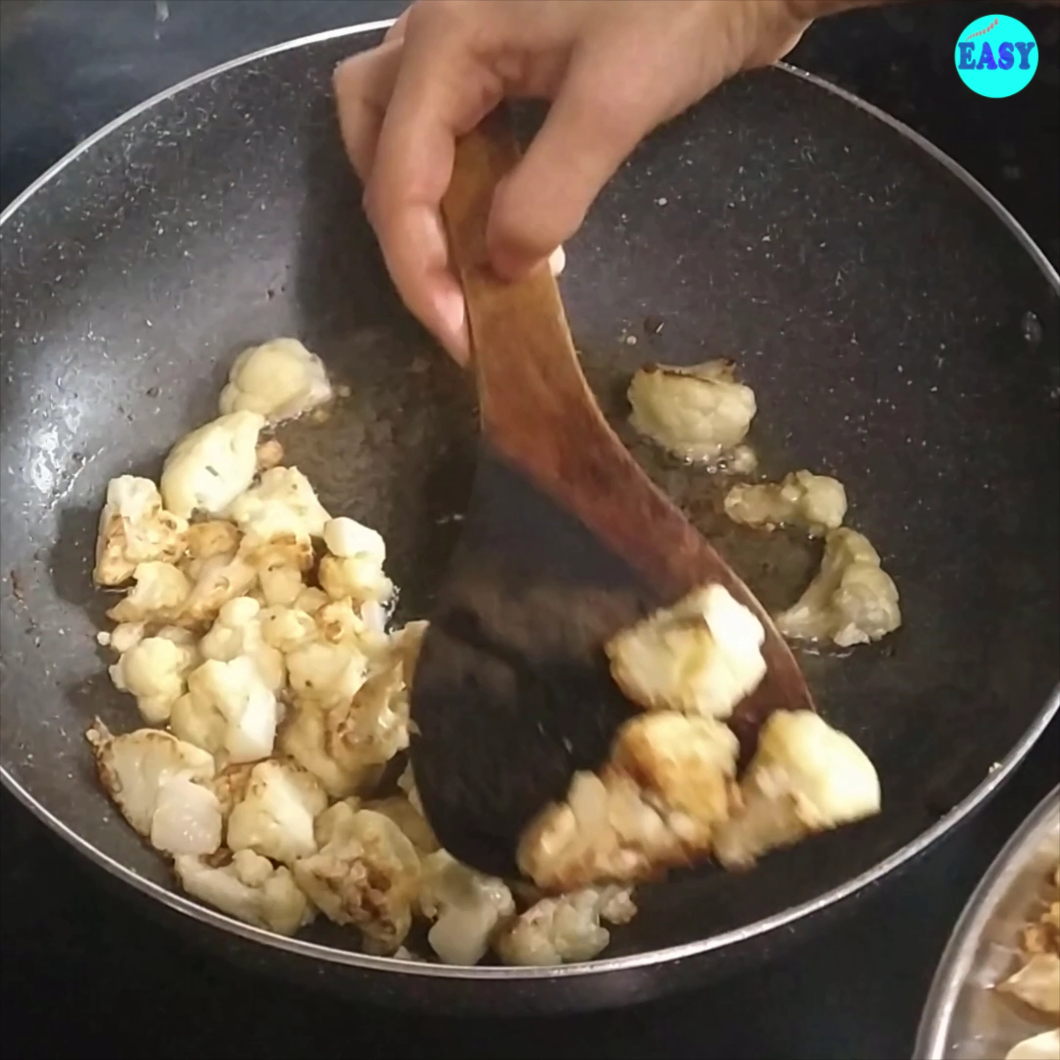 Step 1 - Heat oil in a pan or kadhai. Deep fry or shallow fry the cauliflower until light golden in colour. Drain and keep aside.