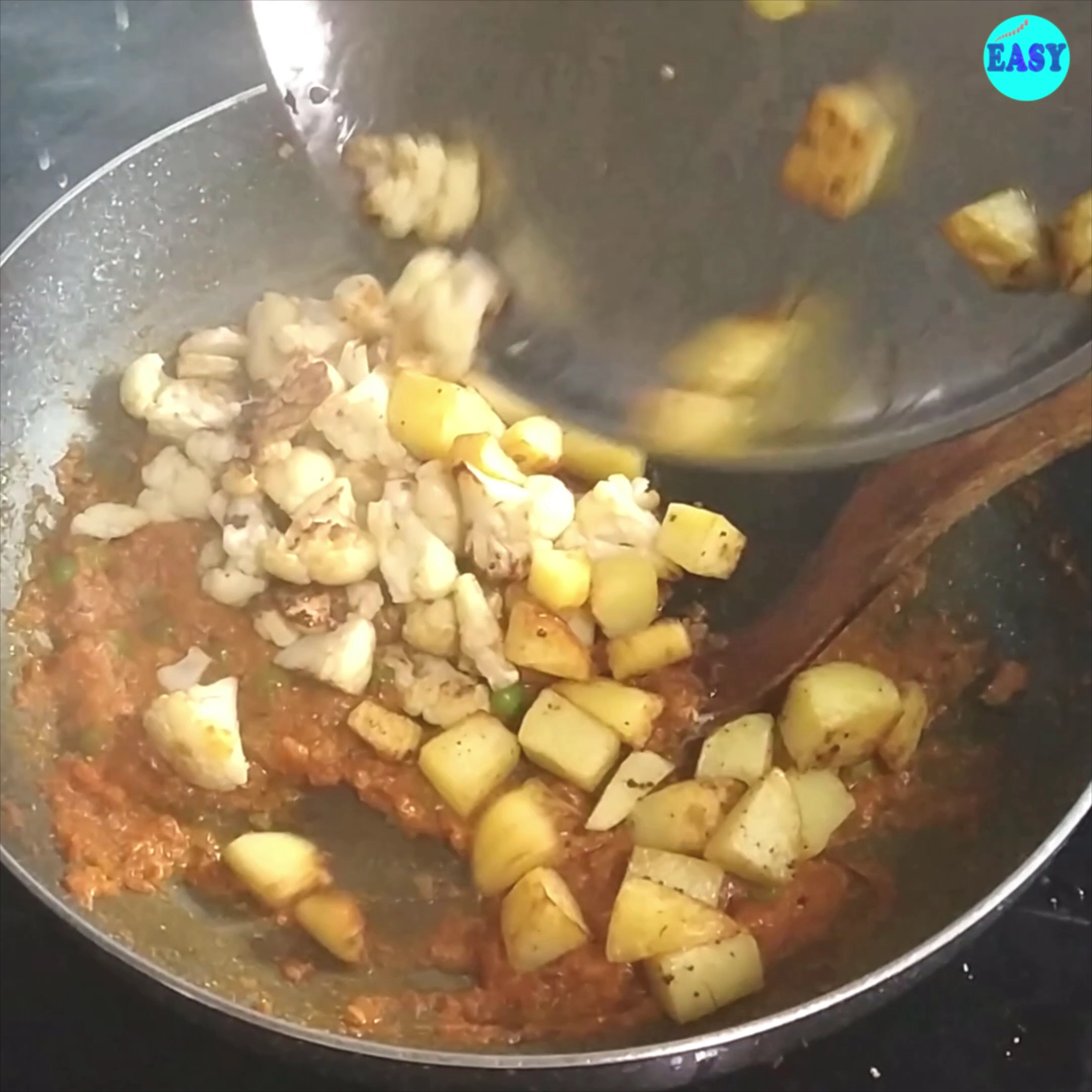Step 8 - Add the fried cauliflower and potatoes and kasoori methi.mix well and cover again. Cook on low to medium heat for 3-4 minutes.